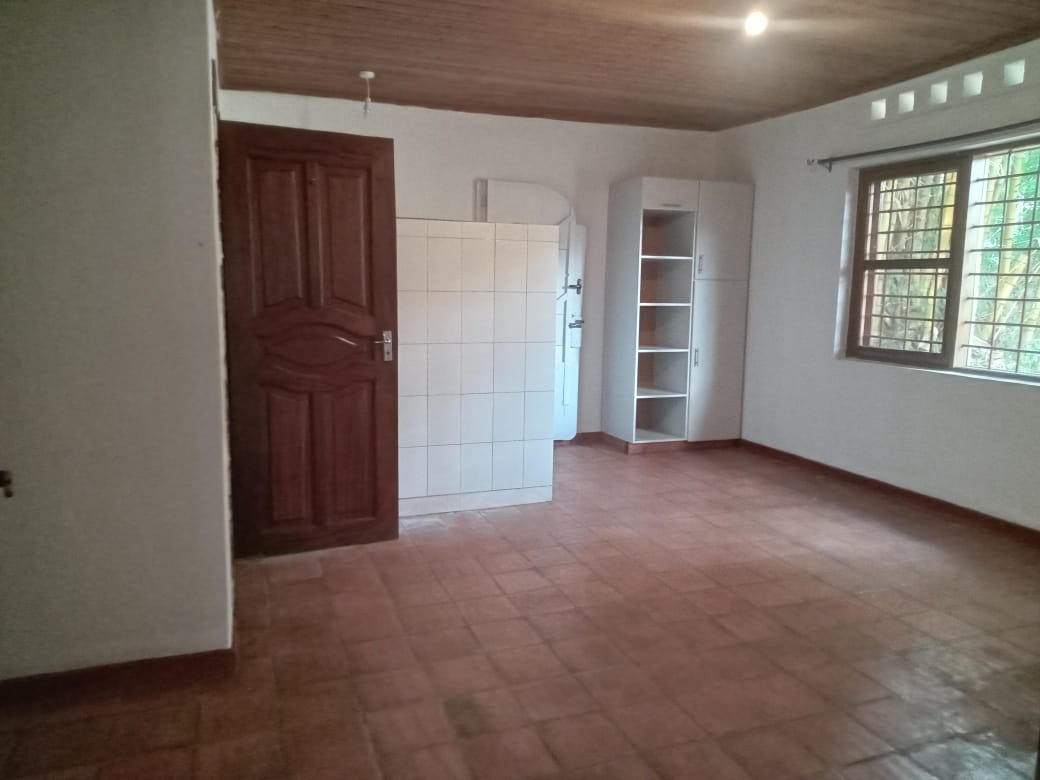 Discover a cozy and peaceful retreat in the desirable neighborhood of Bunga Kawuku. This beautiful standalone 2-bedroom home offers unique character, excellent security, and an abundance of outdoor space. It is perfectly suited for small families, couples, or professionals seeking a quiet residential environment in Kampala.Key Property Features:Warm Interior Details: Highlights a spacious living room featuring rustic terracotta floor tiles and a gorgeous, polished wooden panel ceiling that brings a warm, cabin-like feel to the space.Functional Kitchen: A bright kitchen space with fitted under-counter cabinetry, open shelving, and a large window overlooking the greenery.Spacious Rooms: Features 2 comfortable bedrooms and well-designed built-in white wardrobe storage/shelving units.Massive Lush Garden: Set on a vast, beautifully landscaped green yard filled with mature trees, providing a perfect natural playground (complete with a children's slide) or an outdoor relaxation area.Safe Gated Community: Located within a fully secure, gated compound ensuring maximum peace of mind.Financial Details:Monthly Rent: $700 per monthContact us today to schedule a private viewing of this beautiful Bunga Kawuku home!📊 Meta Tags (For Website Backend Optimization)Meta Title: 2-Bedroom Gated House for Rent in Bunga Kawuku Kampala | $700Meta Description: Looking for a cozy rental in Kampala? View this secure 2-bedroom gated home to let in Bunga Kawuku. Features a massive private garden, wooden ceilings, and quiet neighborhood views.Keywords: house for rent bunga kampala, 2 bedroom house kawuku, gated homes for rent uganda, affordable real estate kampala, rental house with garden bunga